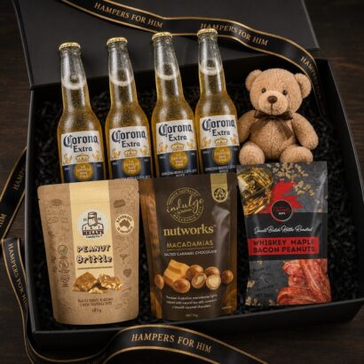 Corona Extra beer gift hamper with 4 bottles of Corona, Kellys peanut brittle, Nutworks macadamias, Wicked Nuts whiskey bacon peanuts, and keepsake bear