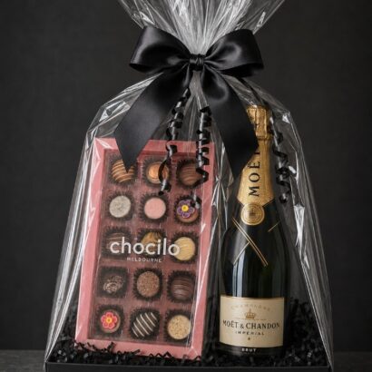 Graduate in Style luxury graduation gift hamper with bottle of Moët & Chandon Brut Champagne, 15-piece Chocilo Melbourne artisan chocolates, black tray base, cellophane wrap and satin bow