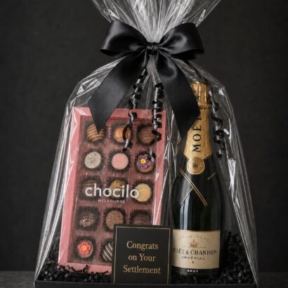 Luxury settlement gift hamper with Moët and Chandon Impérial Brut Champagne, Chocilo Melbourne artisan chocolate selection box, and Congrats on Your Settlement card