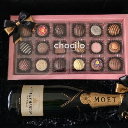 Executive corporate gift hamper with bottle of Moët and Chandon Impérial Brut Champagne, Chocilo Melbourne handmade artisan chocolate selection box, and matte black magnetic keepsake box