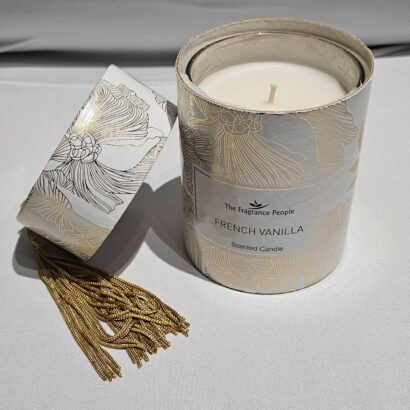 The Fragrance People French Vanilla scented candle in gilded gold botanical gift cylinder with matching metallic gold tassel lid